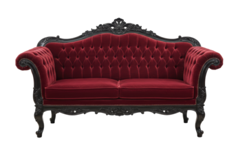 Isolated burgundy-red velvet sofa with carved black frame for luxurious interior design