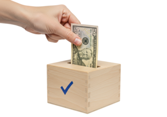 Isolated hand inserting 20 dollar bill into wooden box donation with checkmark symbol