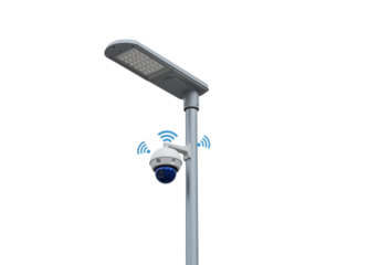 Isolated surveillance camera attached to street lamp pole for monitoring crime prevention