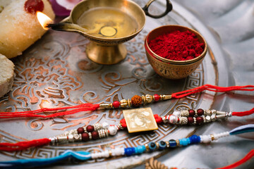 Happy Raksha Bandhan celebration with brother and sister exchanging rakhi, sweets, and gifts