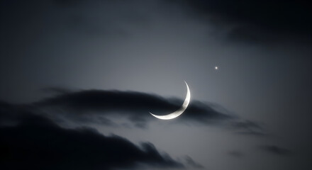 Magical crescent moon and a star illuminate the night sky with an ethereal glow and mystical feel