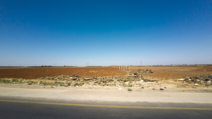 Arid Landscape with Road and Clear Blue Sky