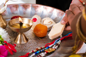 Raksha Bandhan festival in India showing brother and sister bonding with rakhi, sweets, and gifts