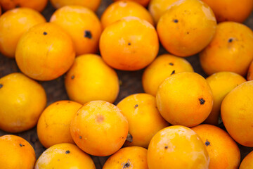 Persimmons pile up in the winter cold.