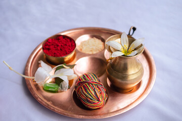 Janai Purnima festival celebration with sacred thread, doro, and Hindu puja items, Kalash, rice, tika, sweets etc.