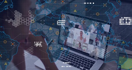 Laptop screen displaying conference grid of colleagues in office with notebook, network overlay