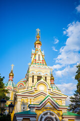 Close-up of the golden domes of Zenkov Cathedral in Almaty, Kazakhstan. With its vibrant painted...