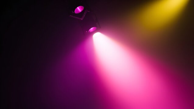 Black-to-purple-pink-yellow gradient with a glowing spotlight effect, resembling stage lighting. Purple and pink hues concentrate in the center, radiating a soft luminous glow
