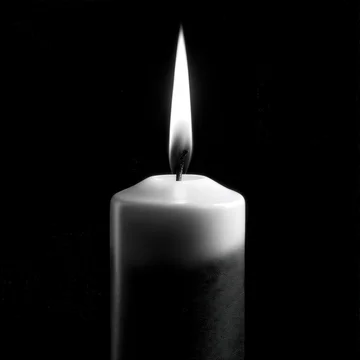 Single Burning White Candle Flame in the Dark.