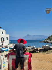 man with a strange umbrella hat