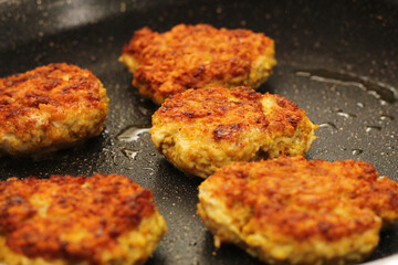 Chicken Kofta Patties Cooking on Hot Skillet