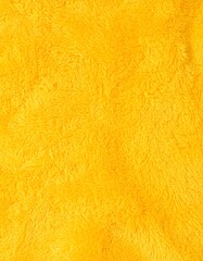 Fototapeta premium Bright yellow fuzzy fabric texture
