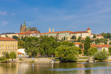 Obraz premium Prague cityscape, the capital of Czech Republic tourist sights. Prague historic center district at Charles bridge during the day. Busy tourist area city sights of Prague, capital of Czech