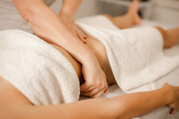 Woman Enjoying Stomach Massage Treatment in Beauty Salon
