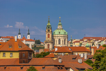 Fototapeta premium Prague cityscape, the capital of Czech Republic tourist sights. Prague historic center district at Charles bridge during the day. Busy tourist area city sights of Prague, capital of Czech