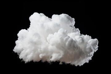Fluffy white cloud against black