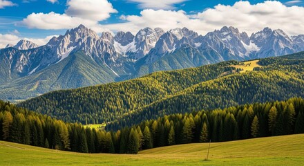 Obraz premium Autumn mountain panorama with forest valley and scenic peaks