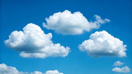 Naklejka premium Fluffy cumulus clouds drifting across a bright blue sky