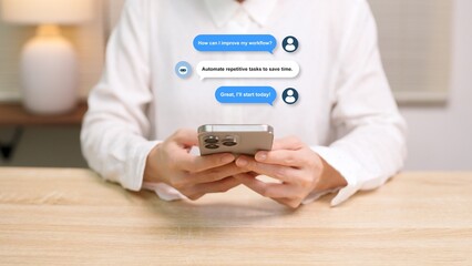 A person using a smartphone with an AI assistant chatbot to improve workflow and productivity at a desk.