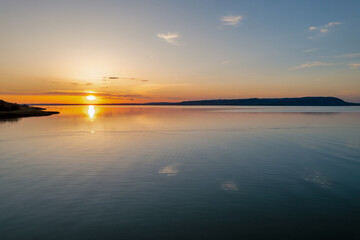 Spectacular sunset over lake Balaton with golden reflections, Hungary.