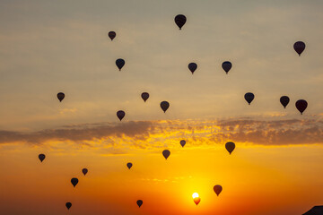 Three hot air balloon against a morning sky. Beautiful view of colourful hot air balloons from below