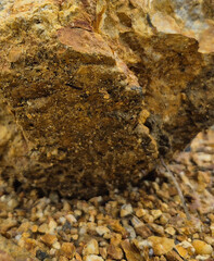 Pile of yellowish-brown rocks with rough textures