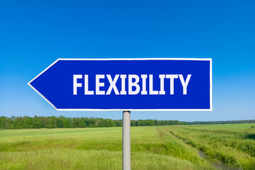 Flexibility symbol. Concept word Flexibility on beautiful blue road sign. Beautiful blue sky green grass and forest peaceful nature background. Business flexibility concept. Copy space.