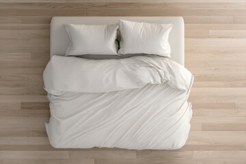 Top-down view of a neatly made white bed with pillows on a light wood floor