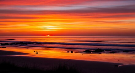 Fototapeta premium Vibrant Sunset Over Ocean Beach Landscape.