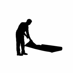 Fototapeta premium Silhouette of installer placing protective foam under sheet isolated on white background