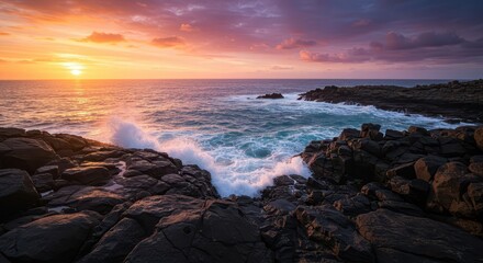 Obraz premium A dramatic seascape at sunrise, showcasing powerful waves crashing against dark volcanic rocks, with vibrant colors in the sky.