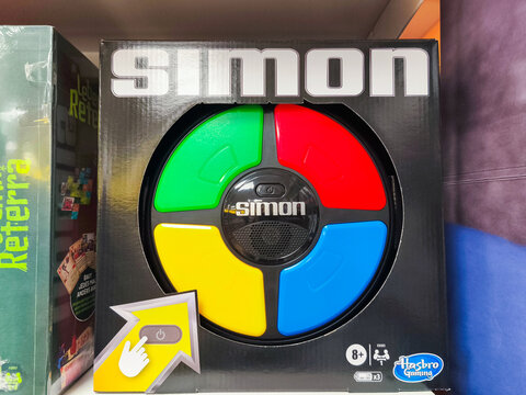 Potsdam, Germany - September 11, 2025: Simon electronic game box featuring colorful buttons in red, blue, green, and yellow, designed for memory challenges and family fun