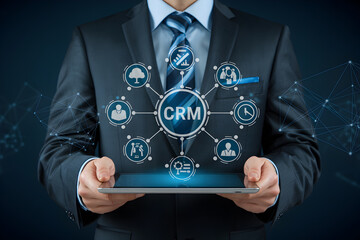 Businessman displays CRM customer relationship management system on a tablet for business solutions