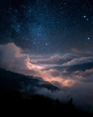 Naklejka premium Breathtaking Night Sky Above Mountains with Stars and Clouds