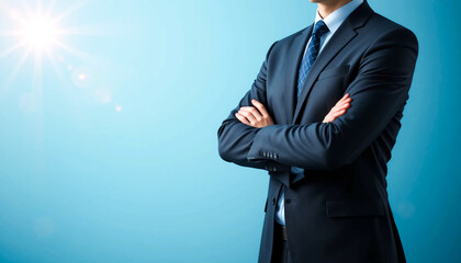 Professional businessman in formal suit standing confidently with arms crossed, partial close-up torso view