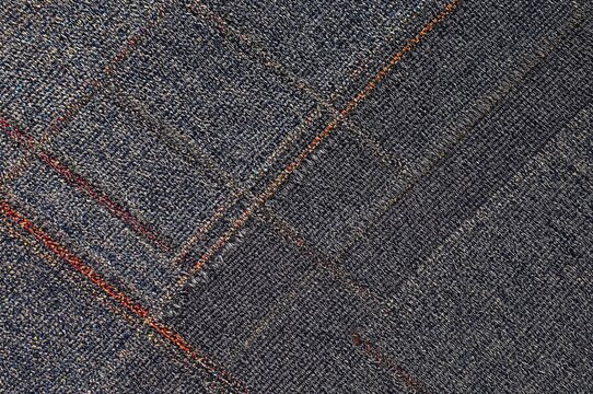 Vibrant circular diamond stitching on an acrylic paint backdrop with gray distortion patterns and ancient woven designs.