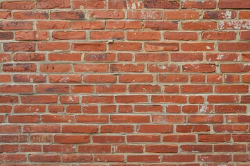 Fototapeta premium Old red brick textured wall with cement and concrete elements