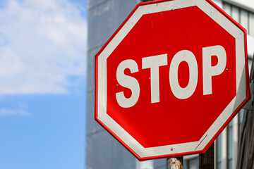 Obraz premium Bright Red Octagon Stop Sign with White Border Symbol Image