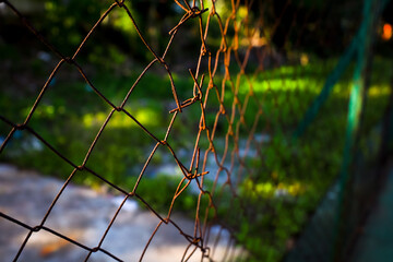 Close-up Focus Rusty and Weathered Metal Chainlink Fence Security Barrier