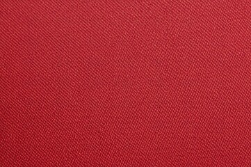 Textured background of red denim fabric with fine line details