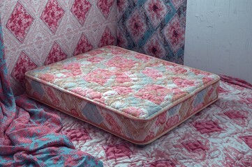 Textured quilted diamond mattress pad with abstract pattern and white color design