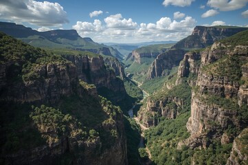 Fototapeta premium Wide view of a dramatic river canyon and three distinctive rock formations in a mountainous region