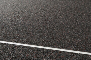 Fototapeta premium Rubber granule-filled cushioned flooring. Unique rubber surface designed for athletic use