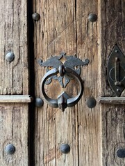 Heavy old wooden door of a cathedral
