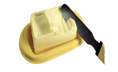 A block of butter on a yellow dish with a knife