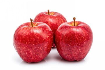 Shiny crimson apples set against a plain white background