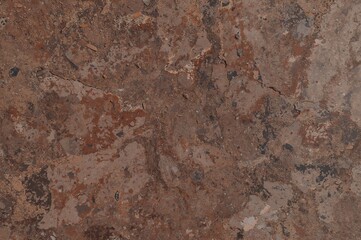 Close-up of a rugged brown rock face with space for text