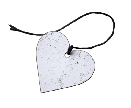 White wooden heart with a black string on a black background.