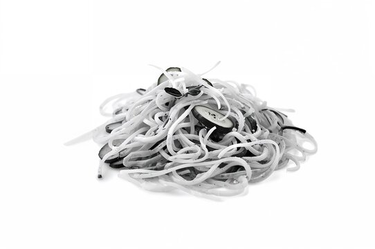 A distinctive Asian cold noodle dish served on a simple backdrop