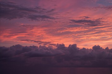 Colorful sunset and clouds over the ocean at dusk